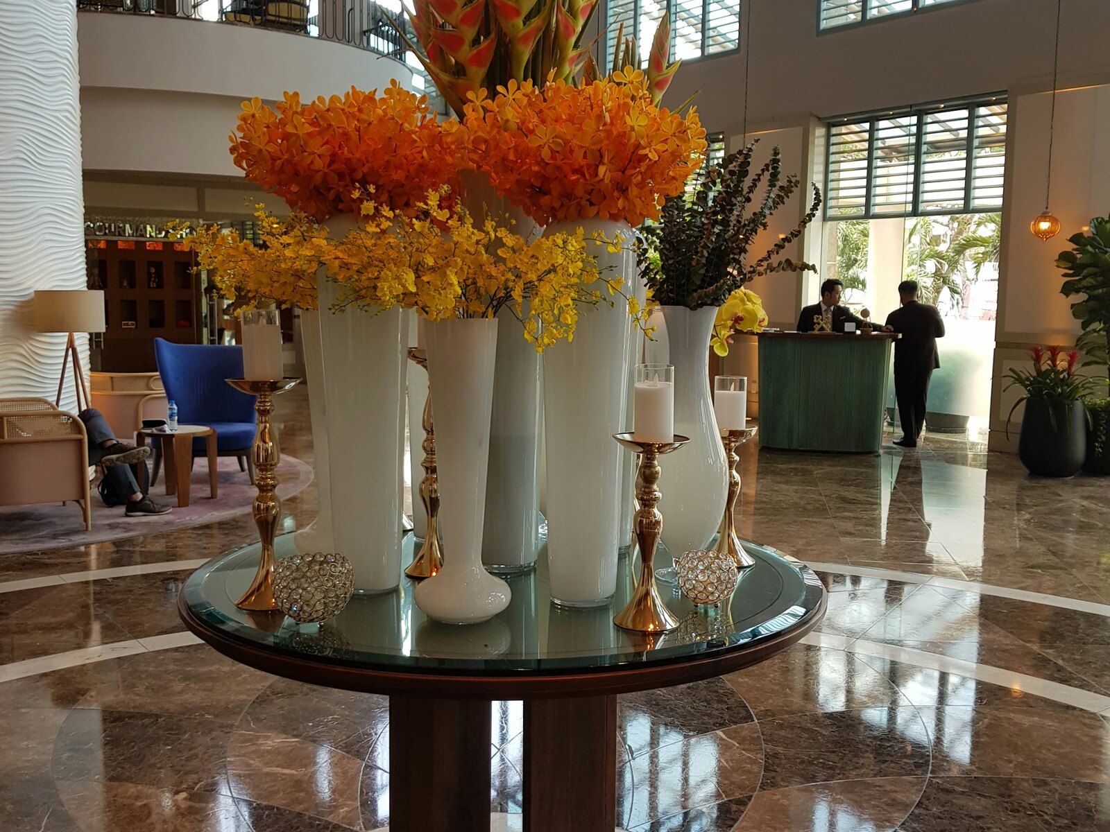 A flower arrangement on a reception desk